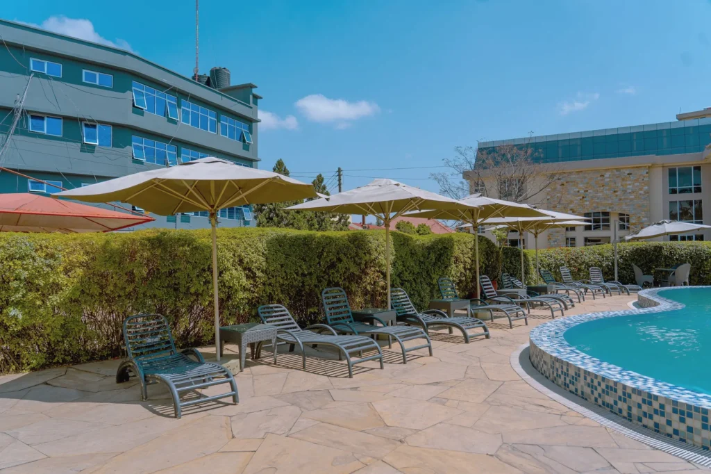 Sun loungers and umbrellas lined along the pool edge